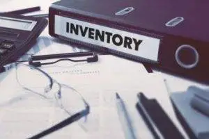 Executor, Inventory binder documents, pens, calculator and reading glasses on a desktop Executor duties